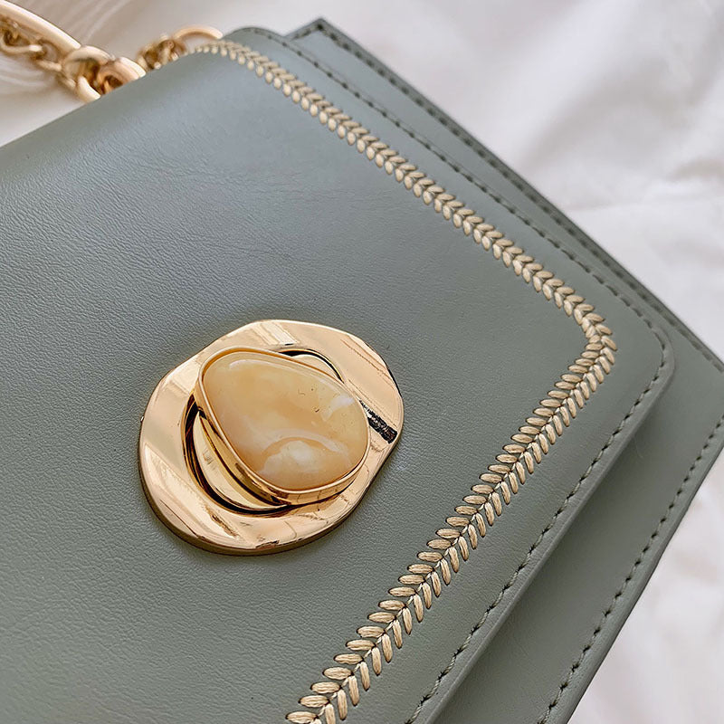 Sleek Metal-Lock Designer Shoulder Bag