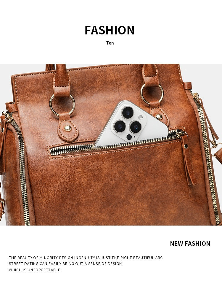 Tote Bag With A Multi-functional, Detachable Shoulder Strap For Handheld Use