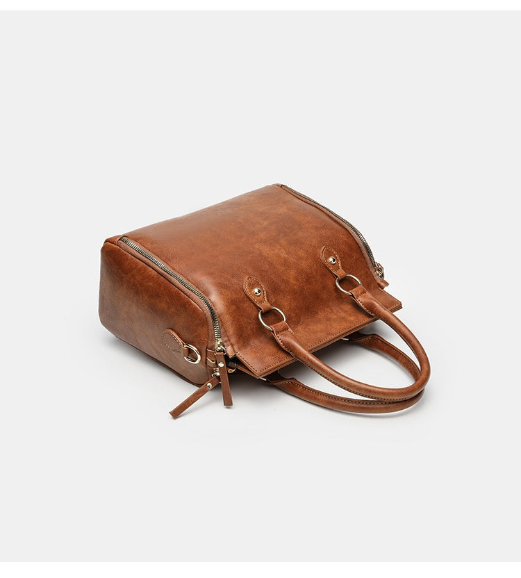 Tote Bag With A Multi-functional, Detachable Shoulder Strap For Handheld Use