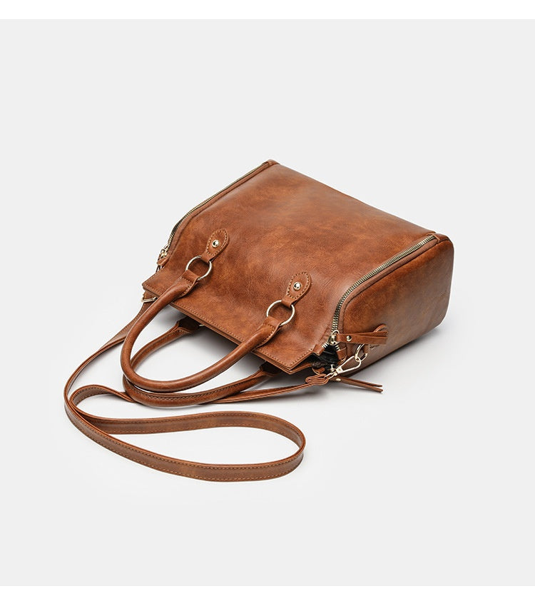 Tote Bag With A Multi-functional, Detachable Shoulder Strap For Handheld Use